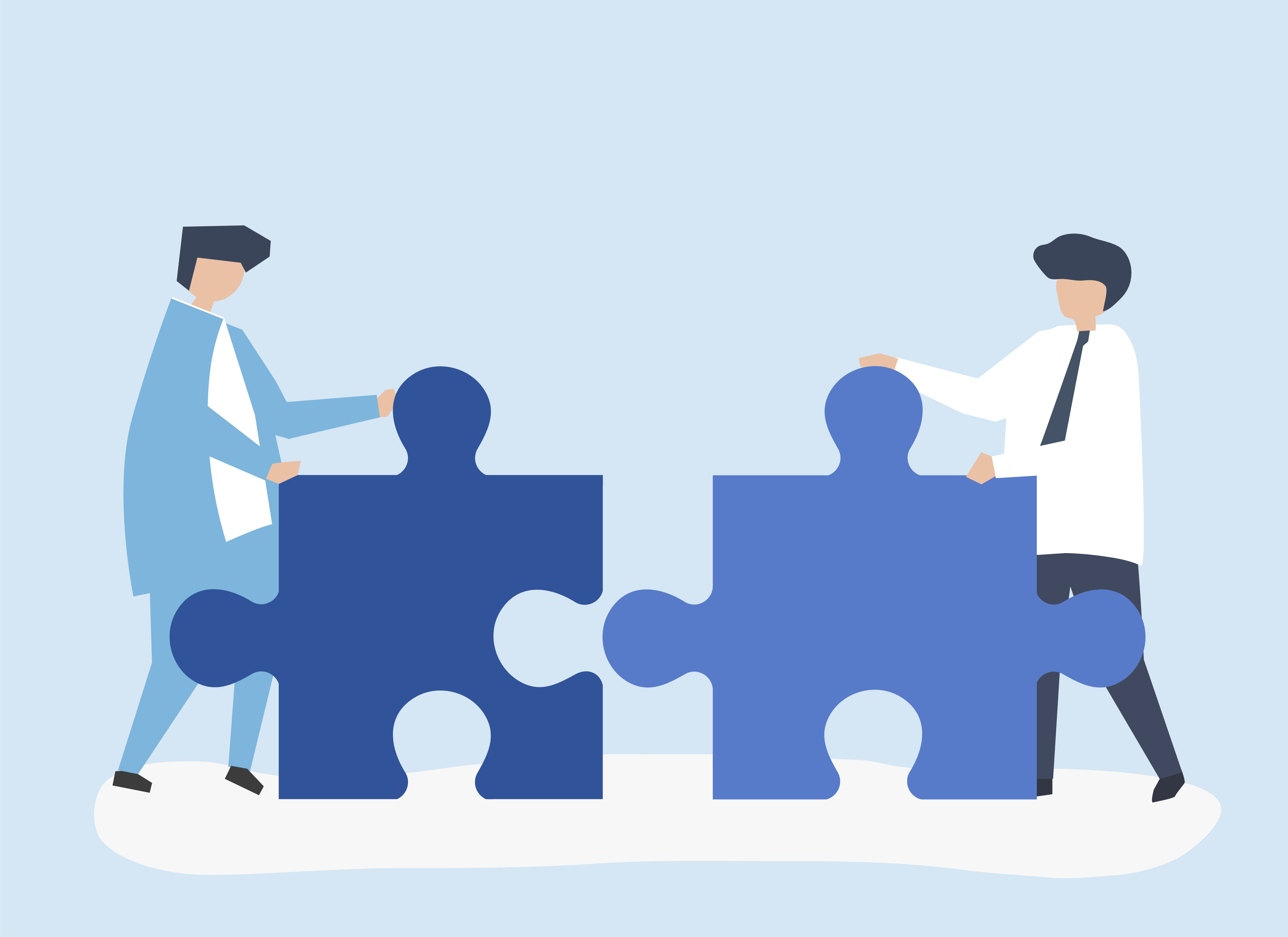 Colleagues connecting jigsaw pieces together Partners
